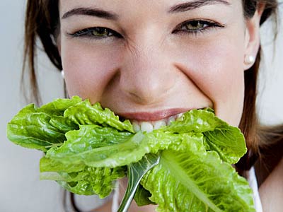 woman-biting-lettuce