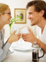 couple happy holding coffee 150 Want to Ace the Interview? Offer a Warm Handshake