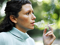 woman-smoking-blue-sweater