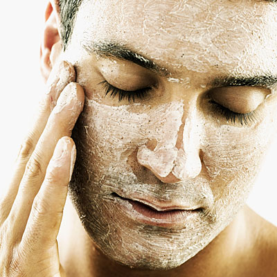 man-exfoliating-face