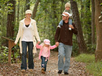 family-hiking-woods