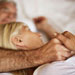 couple-bed-hands
