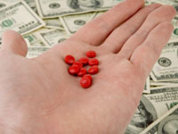 money-hand-holding-pills