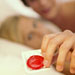 couple-condoms-hand