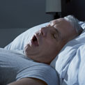 man-sleep-apnea-snoring