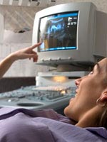woman-looking-embryo-monitor-150.jpg