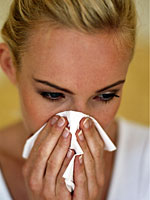 blonde-woman-blowing-nose