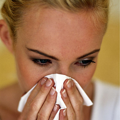 blonde-woman-blowing-nose