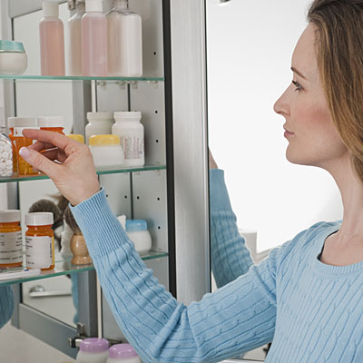 medicine-cabinet-woman-pill