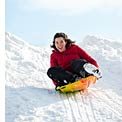 woman-sledding-park