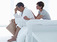 couple-upset-bed