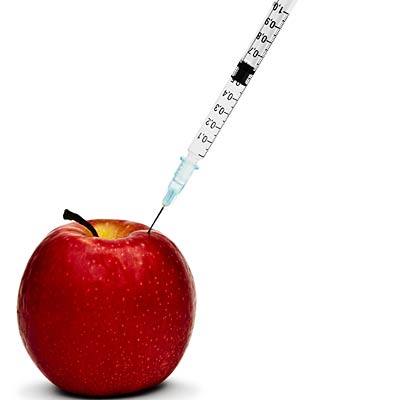 syringe in apple