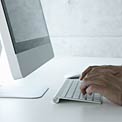 hands typing on a laptop