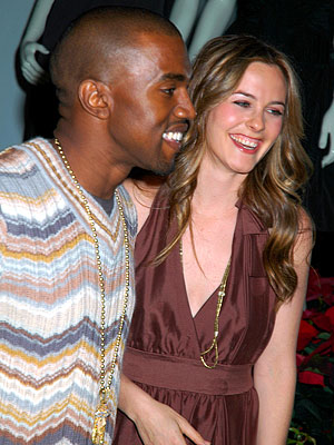 Kanye West hosted Alicia Silverstone at a holiday window lighting for the 