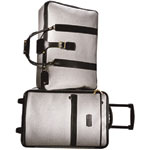 Coated-canvas suitcase with leather trim (H: 16", W: 24", D: 6") and coated-canvas wheeled carry-on with leather trim (H: 22", W: 14", D: 9", both also in black/tan, red/black and purple/dark brown), T. Anthony.