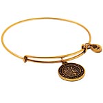 Gold-plated wire bangle with a St. Christopher charm, Alex and Ani.