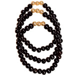 Ebony mala bead bracelets with 14kt-gold beads, Lisa Freede.