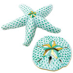 Handpainted porcelain with 24kt-gold accents: starfish (4", $210) and sand dollar (3", $110), Herend.