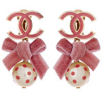 Gold earrings with glasstone pearls and velvet bows, Chanel.