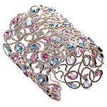 Cuff of diamonds, sapphires and aquamarines set in 18kt gold, Chopard.