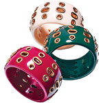 Plastic bracelets with metal grommets, Alexia Crawford.
