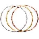 Bamboo bangles in sterling silver and 18kt-gold plate, Sloane Designs.