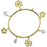 20kt gold with charms of pearl and 18kt gold, S. Aufrichtig.