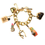 Brass bracelet and charms, Juicy Couture.