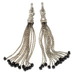 Earrings Etched hoops of 18kt gold leaf and pavé diamonds with tassel charms of 18kt gold, diamonds and sapphire, Loree Rodkin.