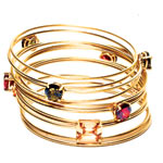 18kt-gold-vermeil bangles and 18kt-gold-vermeil bangles with quartz, M+J Savitt.