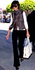 Katie Holmes in J Brand, carrying Tod's