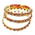 18kt-gold bangles with sapphires, Emily and Ashley.