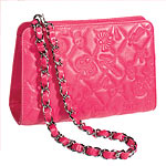 Quilted-and-embossed 7"x4 1/2" pink lambskin purse (also in gold or silver), Chanel.