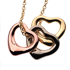Open-heart 1/3" charms in 18kt rose, white and yellow gold (16"chain), Elsa Peretti for Tiffany & Co..