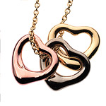 Open-heart 1/3" charms in 18kt rose, white and yellow gold (16"chain), Elsa Peretti for Tiffany & Co..