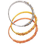 Bracelets of sterling silver with vermeil and 24kt rose and yellow gold vermeil, Alexis Bittar.