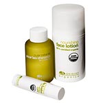 From left: soothing lip balm, hair oil and face lotion, Origins