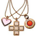 Pendants in gold plate and glass, Coach.