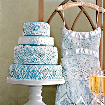 White royal icing and fondant mimic the embroidery while silver dragees 
