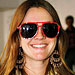 Drew Barrymore in red sunglasses.