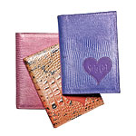 Croc- and lizard-embossed leather notebooks, Surly Girl.