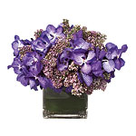 Orchid-and-lilac arrangement, Banchet Flowers.