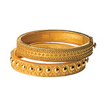 22-kt gold bracelets, Ilias Lalaounis.