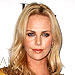 Charlize Theron with a Jimmy Choo clutch