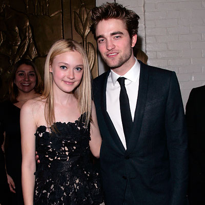 Dakota Fanning in Valentino and Robert Pattinson in Gucci - Hollywood Premiere of The Twilight Saga: New Moon