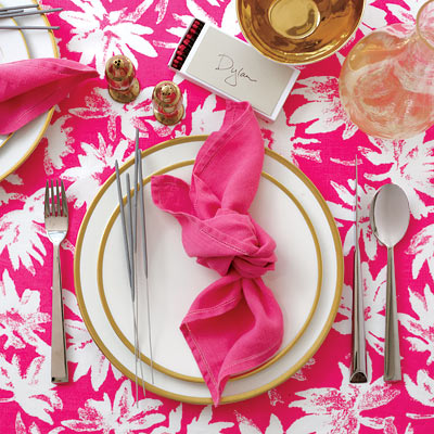  boldpatterned tablecloth with knotted napkins and silver flatware 