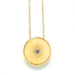 14-kt-gold pendant with diamond on front and ruby on reverse, Lizzie Scheck Jewelry.