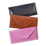 Leather travel-envelope wallets with contrasting interiors, in black, pink and Luggage, Abas.