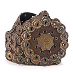 Adjustable suede belt with bottle-cap grommets, Anthropologie.