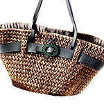 Straw bag with leather trim and enamel buckle, Anya Hindmarch.